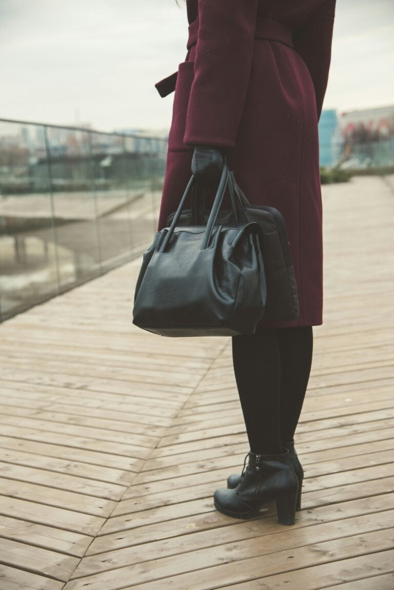 Stay Updated on the Latest Job Opportunities Worldwide 1 woman standing while holding black bags