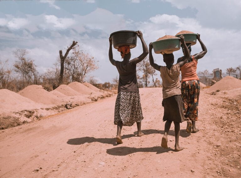 Exploring Job Opportunities Around the World 3 three women carrying basin while walking barefoot