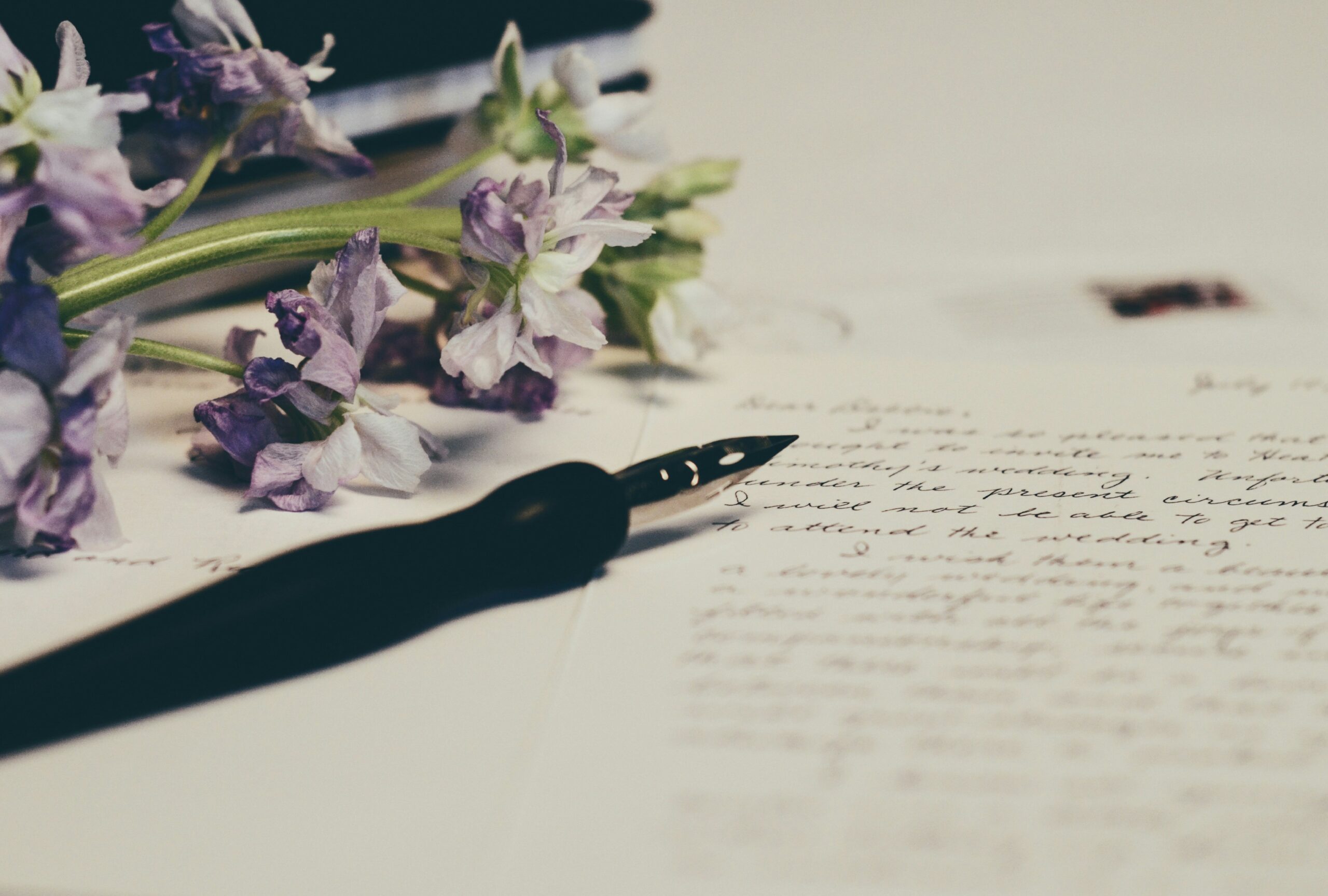 How to Draft a Resignation Letter, Politely 1 purple flowers on paper