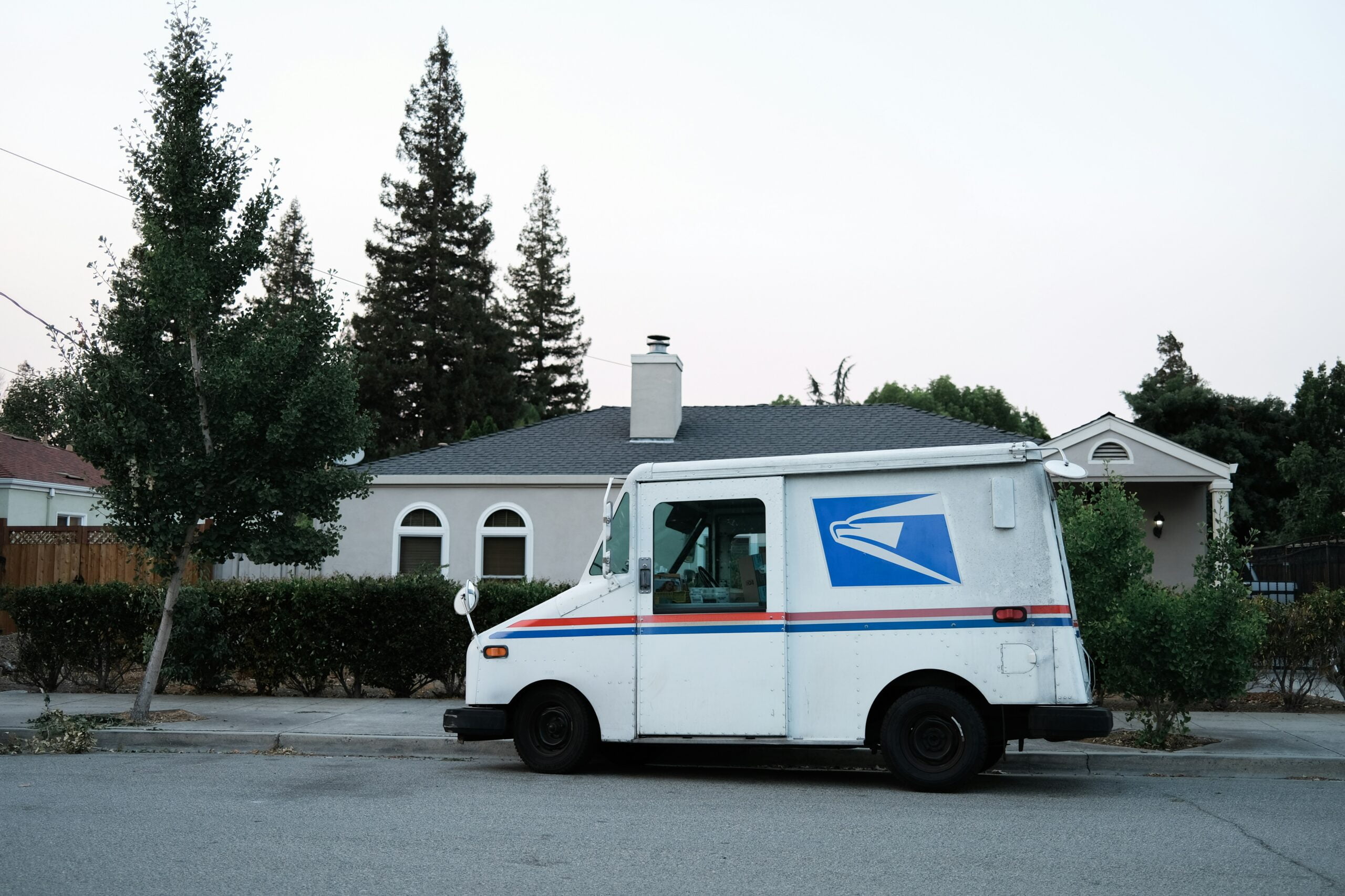How to Become a UPS Driver: Qualifications, Application Process, and Tips for Success 4 white and blue van on road during daytime